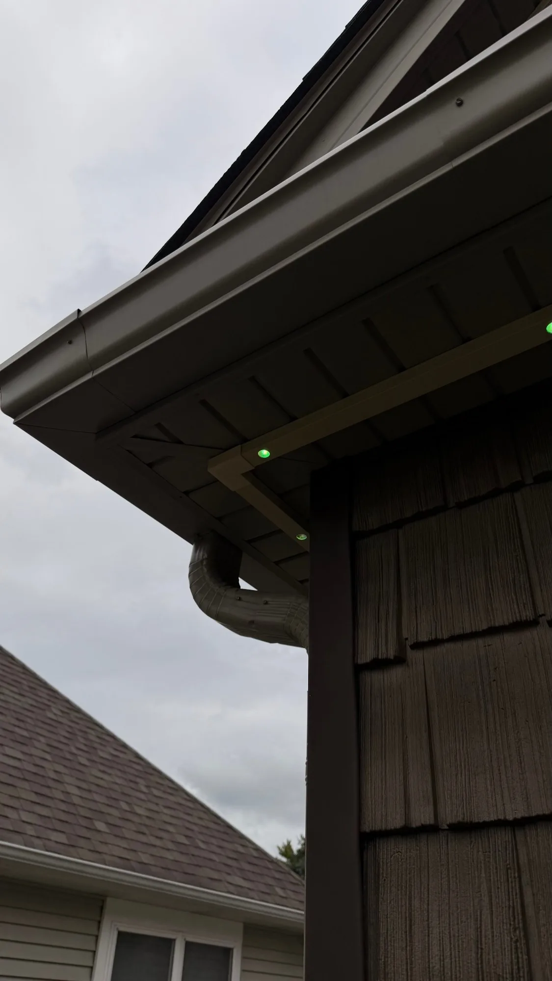 Govee permanent lights in dark brown SnapTrack soffit channel — color-matched snap-on mount installation by First Frost Palatine IL